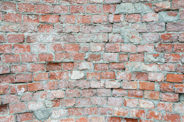 texture of an old brick wall with traces of destruction