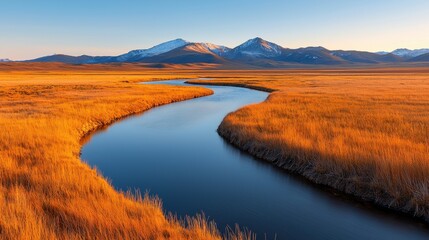 Serene landscape with a winding river and mountains at sunset.