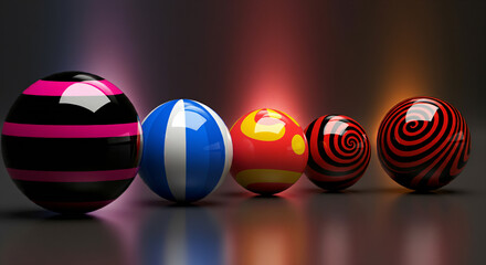 Five glossy spheres in various colors and patterns against a dark background.