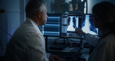 Radiologists Analyze Chest X-rays in a Medical Monitoring Room, Examining Digital Scans on a...