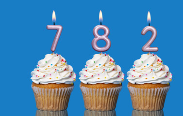 Birthday Cupcakes With Candles Lit Forming The Number 782