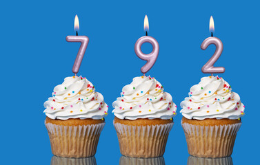 Birthday Cupcakes With Candles Lit Forming The Number 792