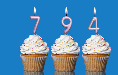Birthday Cupcakes With Candles Lit Forming The Number 794