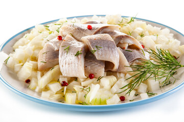 Marinated herring fillets with onion on white background