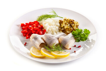 Marinated herring fillets with vegetables on white background