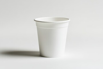 White disposable cup with smooth finish placed on a clean white background,