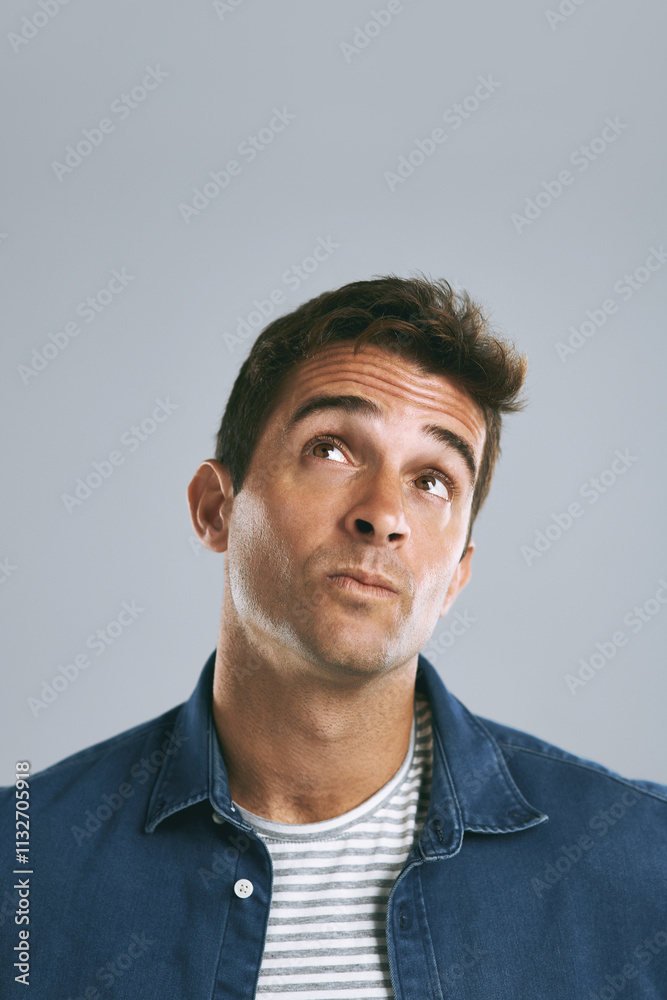 Aufkleber Man, confused and doubt with thinking in studio for planning, contemplating and unsure on mockup space. Person, thoughtful and wondering with question, solution and problem solving on gray background