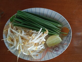 Vegetables, food, lemons, bean sprouts, coriander on the plate