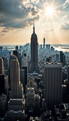 Fototapeta premium Majestic aerial view of a city skyline with iconic skyscrapers and rays of sunlight breaking through clouds