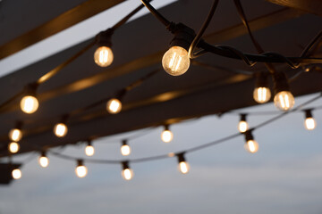 Enhance your outdoor gatherings with festive string lights that create a cozy evening ambiance