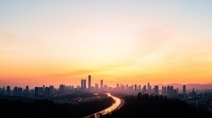 Naklejka premium Sunset Over Urban Skyline with Road Leading to City Lights