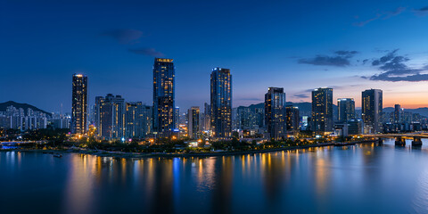 Fototapeta premium City Skyline with River and Sunset Glow