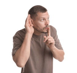 Man showing hand to ear gesture on white background
