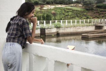 portait asian Thai girl with Overflow weir