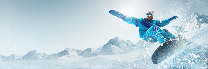 Banner. Energetic snowboarder dressed in bright colors turning sharply, scattering snow under radiant sunlight, framed by crisp, clear winter skies. Concept of extreme sport, ski-resort, holidays. Ad