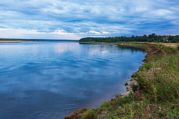 Colorful blue summer sunset on the northern river