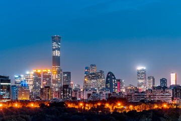 Fototapeta premium High angle night view of Red Scarf Park, a complex of CBD buildings in Beijing, China