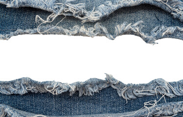Piece of torn denim on a white background. Denim texture