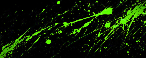 Abstract black background with vibrant neon green paint splatters