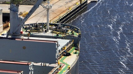 Ocean going cargo ship docked in port at Brunswick, Georgia where it is being loaded with products...