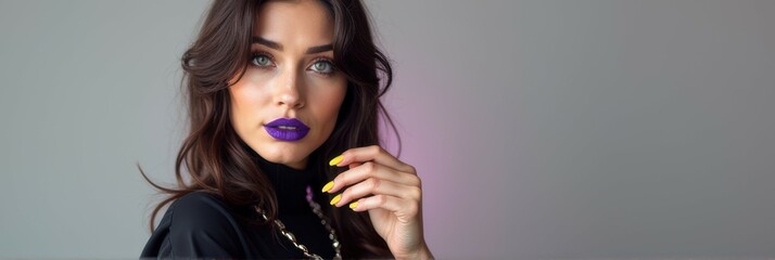 Fototapeta premium Young caucasian female with vibrant purple lipstick and stylish nails posing