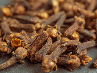 A close-up of aromatic cloves, highlighting the texture and rich color