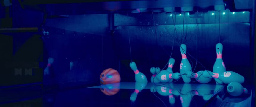 bowling ball hitting pins slow-motion