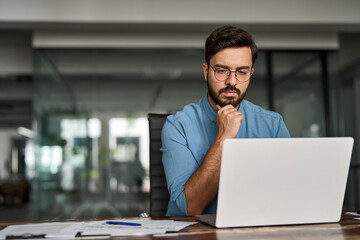 Busy professional business man company employee, young male programmer businessman looking at...
