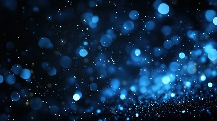Obraz premium Blue bokeh particles with sparkles on dark background. Magic celebration concept