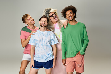 Fototapeta premium Four friends showcase their unique styles and joyful expressions in a celebratory atmosphere.
