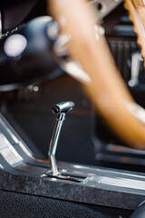 Classic Car Interior Focused on Gear Shift with Vintage Steering Wheel View