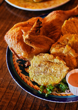 Roasted chicken with fried plantains food plate