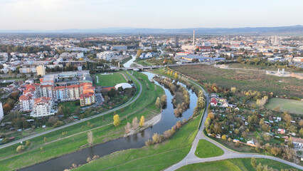 Flood polder protection on Morava river in Olomouc, island building city bank increases capacity for flood low-lying tract land, regulated regulation artificial hydrological entity embankments Europe