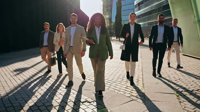 Modern Business People Team walking together with confidence and determination - Group of diverse professionals in the city