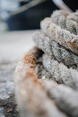 Close-Up of a Frayed Marine Rope in Focus, Symbolizing Strength and Durability with a Nautical Theme