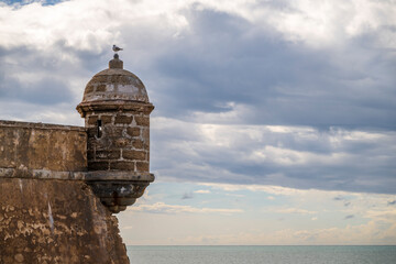 Castle of San Sebastián, a stone fortress in Old Town Cadiz, Spain where the Temple of Kronos once stood. The Cádiz Castillo de San Sebastian was declared a cultural landmark in 1985. © parkerspics