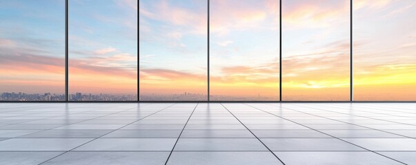 Fototapeta premium A modern interior space with large glass windows showcasing a beautiful sunrise over a city skyline.