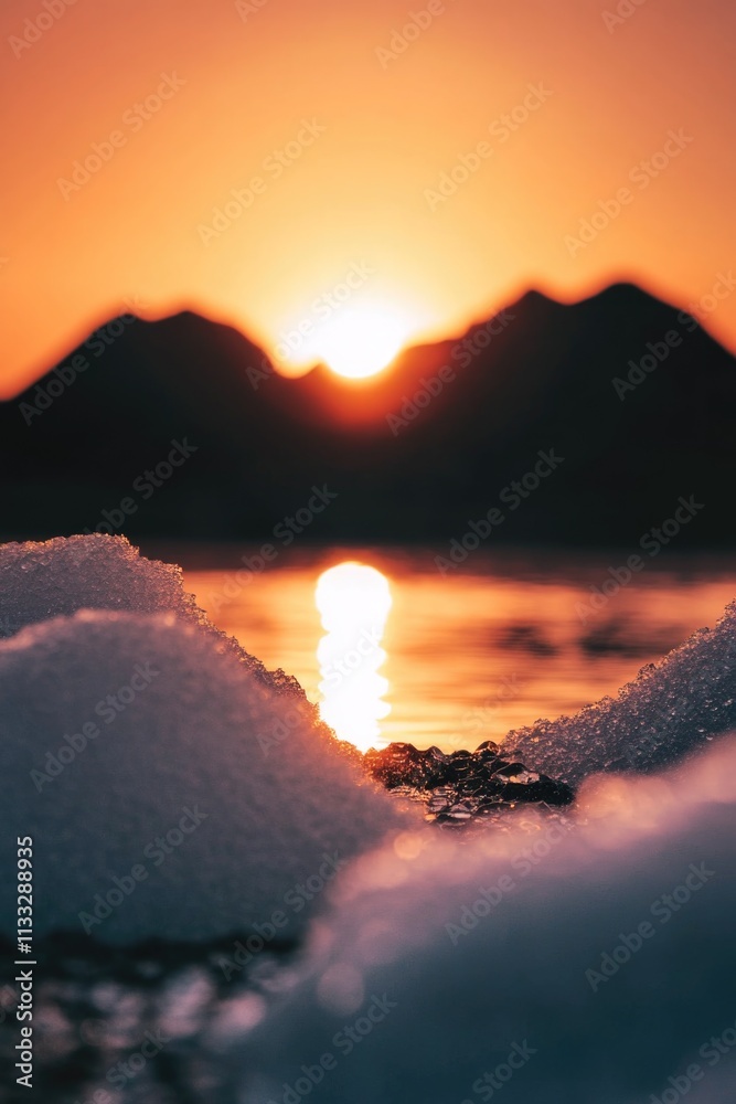 Poster a serene scene of the sun setting over melting ice, perfect for use in environmental or climate chan
