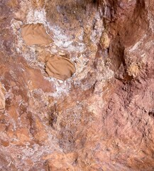 Natural rock reddish. Texture of stone, granite marble travertine close up. Stone wall texture. Vintage abstract brick background.