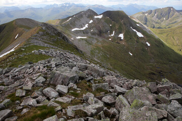 Fototapeta premium Ascent path to Binnein Mor and Na Gruagaichean - View towards Glen Nevis and water of Nevis valley - Mamores - Highlands - Scotland - UK