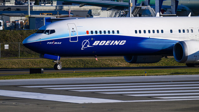Everett, WA, USA - December 4, 2024; Closeup Boeing 737 MAX 10 passenger aircraft taxiing on runway in company colors