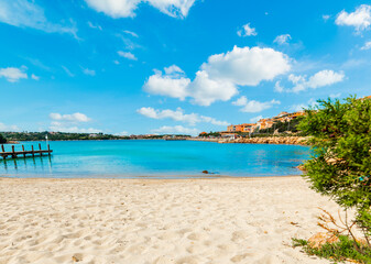 Fototapeta premium Beautiful beach in Porto Cervo under a blue sky with clouds