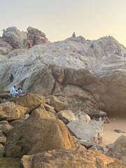Beautiful sunset on Karachi beach in the evening at rocky hills in Karachi.