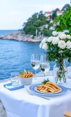 Fototapeta premium Artistic photography of a table for two set by the seaside.