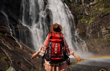Adventure Awaits A Traveler at a Majestic and Breathtaking Waterfall Experience