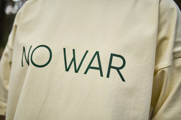 Close-up of T-shirt with No War Message, Anti-War Statement, Peaceful Protest Symbol, Activism, Global Peace Concept