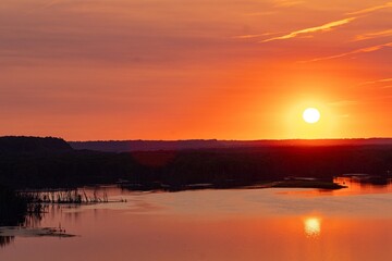 Obraz premium sunset over the river