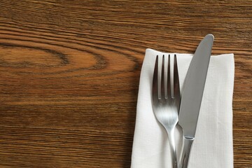 Cutlery  on a wooden background, top view