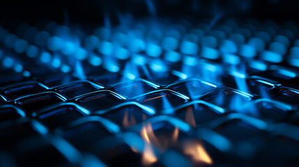 Obraz premium Close-up view of blue flames igniting a gas stove, showcasing culinary energy.