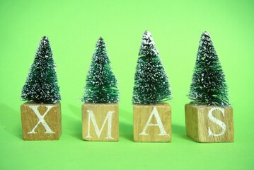 Wooden blocks with a Christmas tree and the word Christmas
